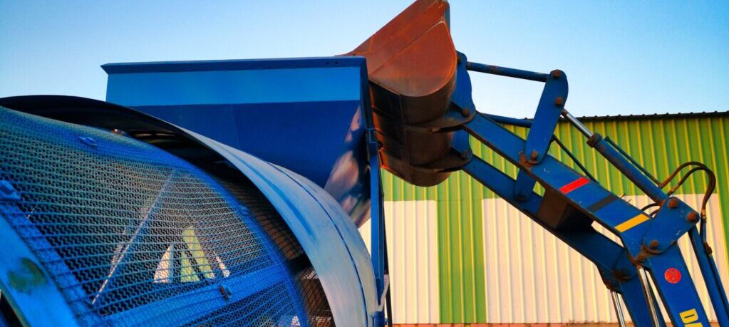 How can the Trommel Rotary Screen be customized to meet specific requirements for different wood biomass processing capacities?